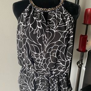 Gorgeous black and white blouse with unique wrap around necktie
